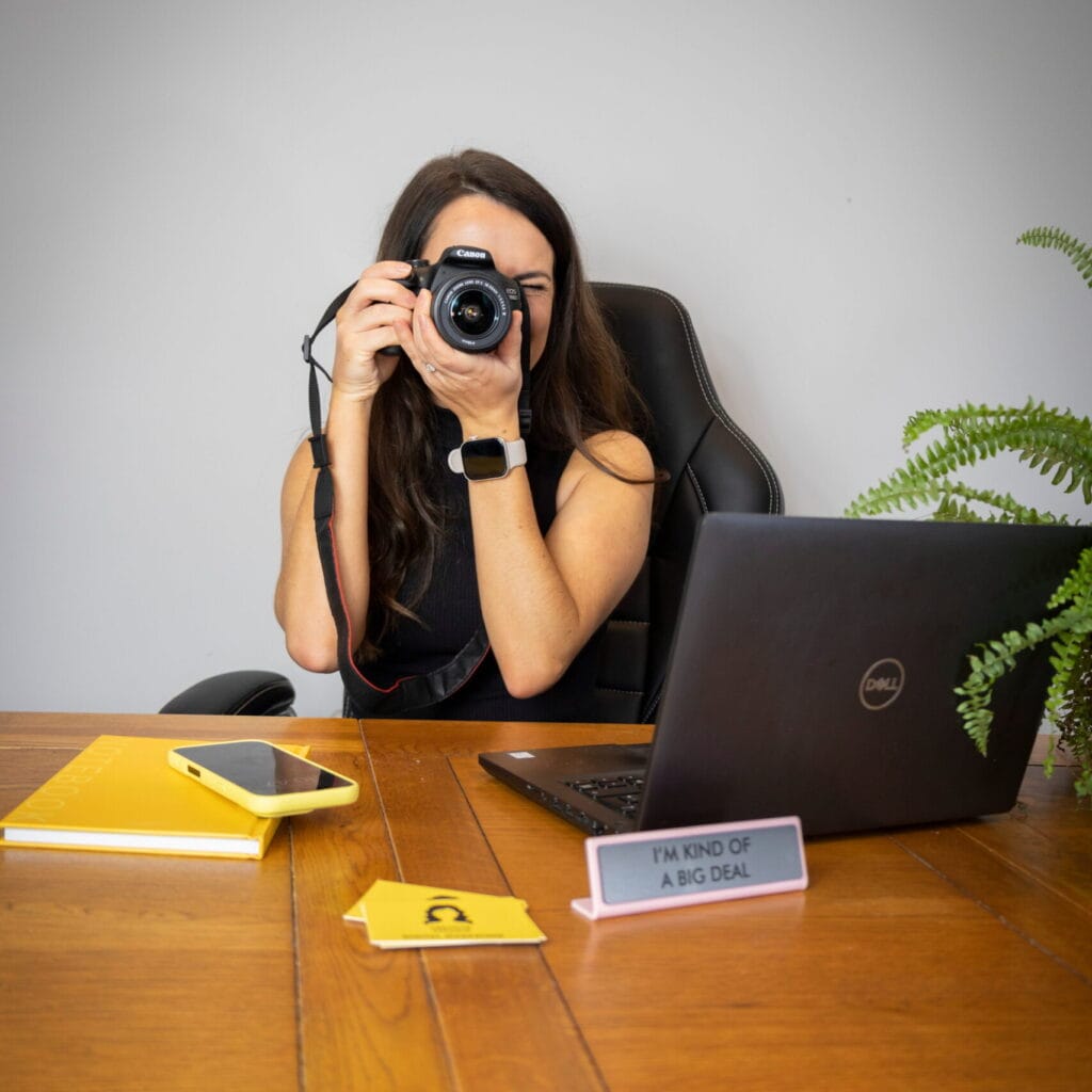 Team member pointing a camera ready to take a photo