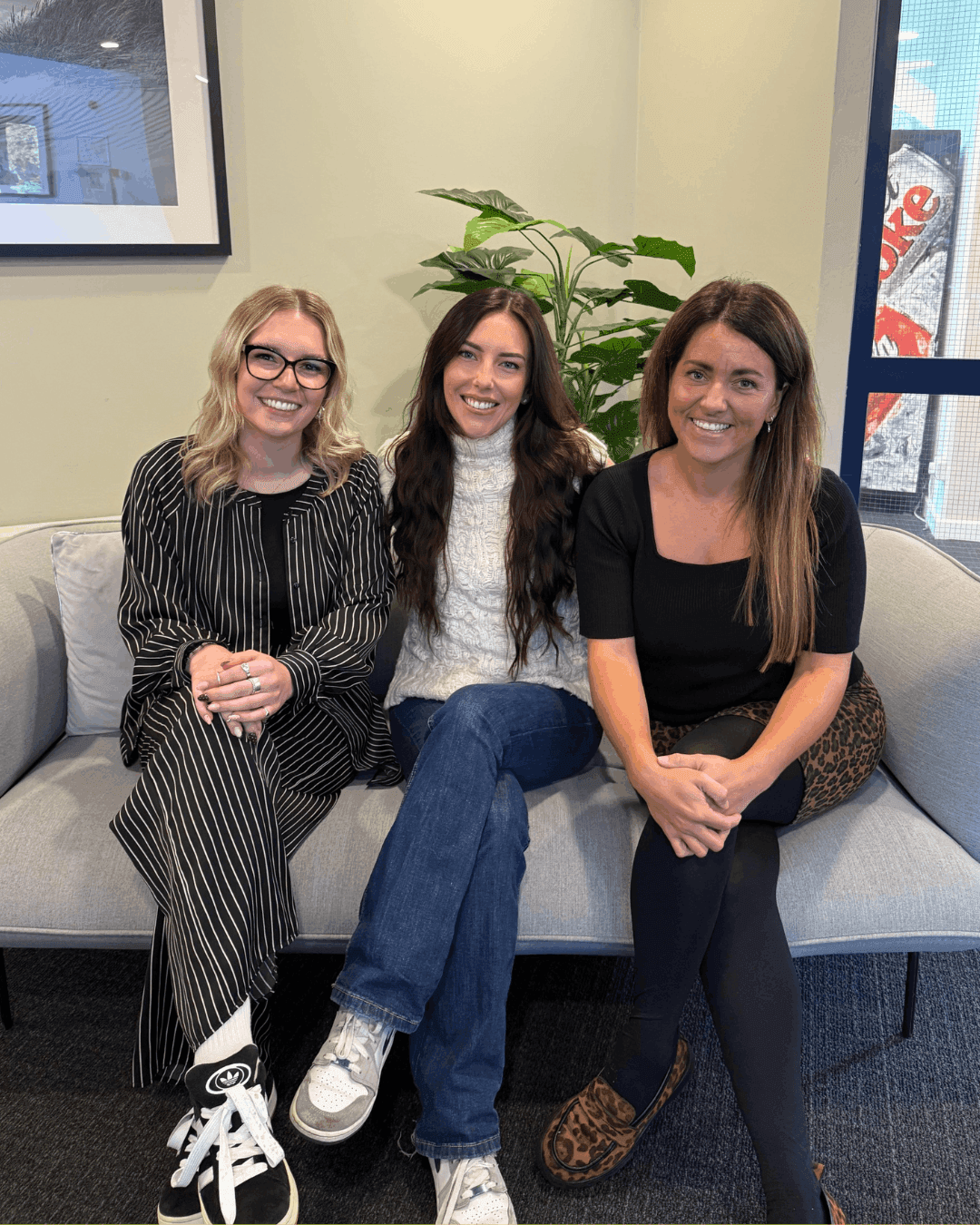 Natalie sitting with two team members from Catapwlt