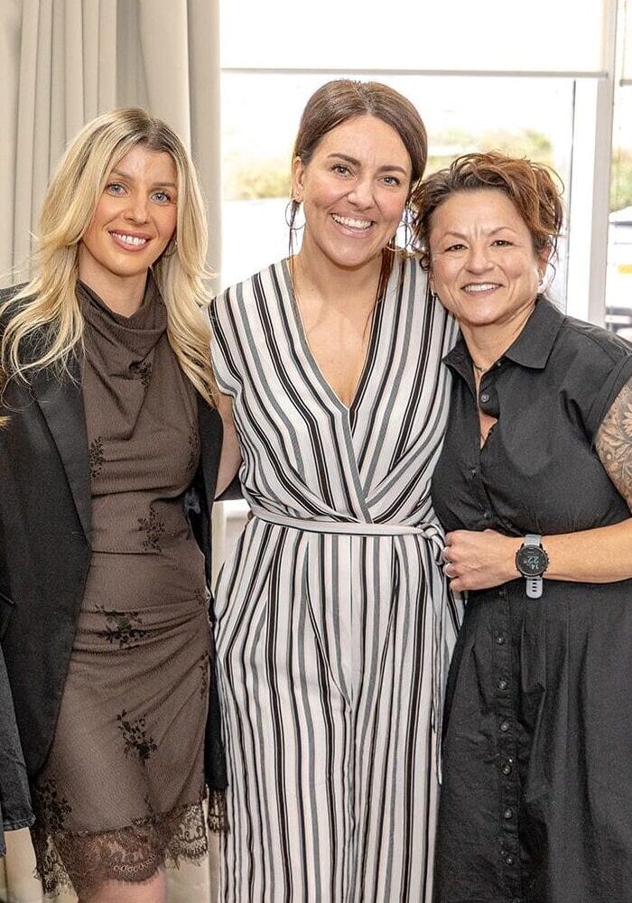 Natalie standing in the middle with a lady either side