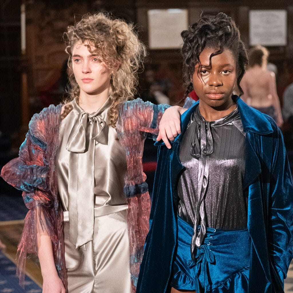 Two people wearing fashion clothing