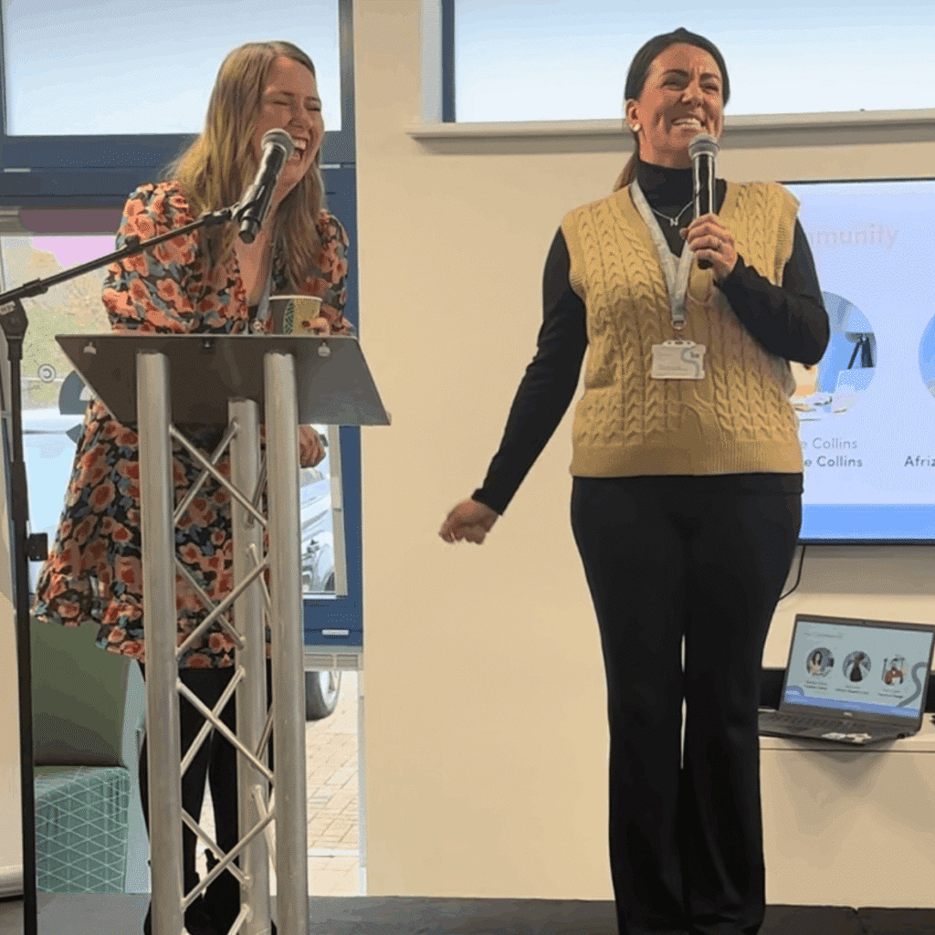 Natalie standing up at making a presentation